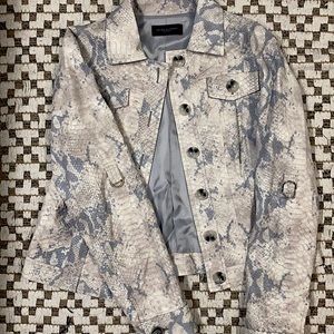 A beautiful baby blue, snake skin patterned overcoat by Javier Simorra